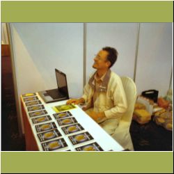 asi-booth-daniel-greeting-people.jpg