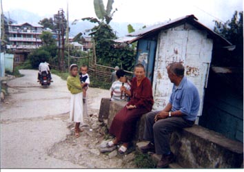 Prayer wheel held by Buddhist monkess, hoping to gain favor depending on many times she can spin it around.  So sad.  Who will tell her about Jesus?